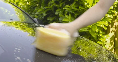 Washing a Car by Hand - camera pan - ProRe Vídeos de archivo 88907572