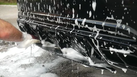 Washing car rear diffuser with shampoo Stock Footage 142718944