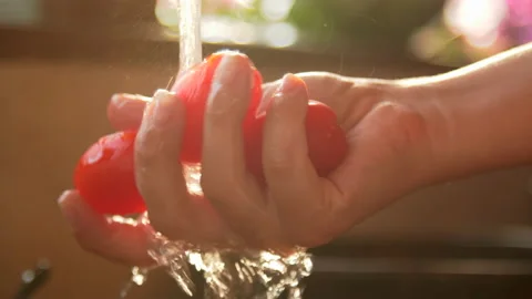 Washing cherry tomatoes, 4k Stock Footage 130674118