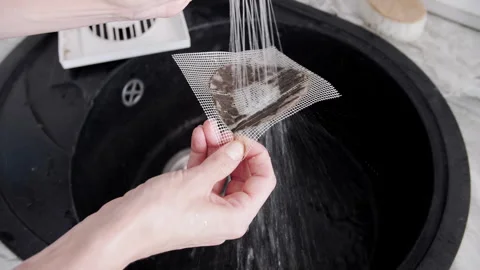 Washing Clogged Dusty Ventilation Mesh Filter Under Water Stream in Sink Video stock 341397234