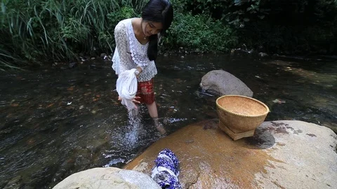 Washing Clothes in the River Stock Footage 125173906
