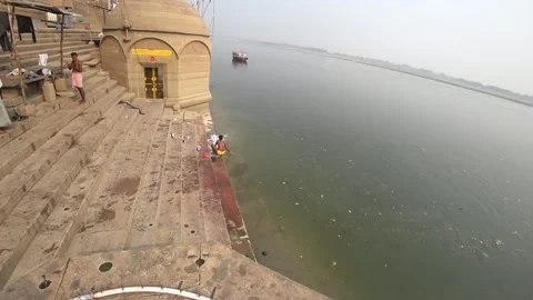 Washing clothes in the river ganges Stock Footage 157361403