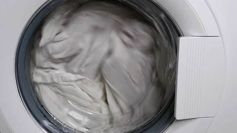 Washing clothes in a washing machine. Stock Footage 157981823