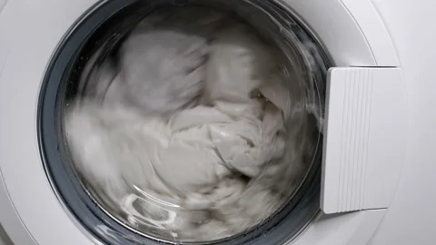 Washing clothes in a washing machine. Stock Footage 159061663