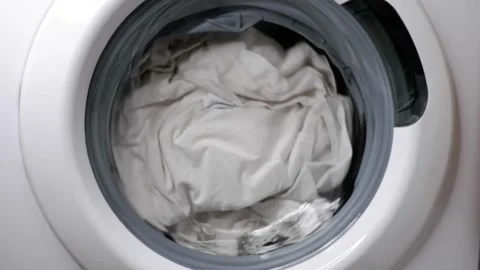 Washing clothes in a washing machine. Stock Footage 166103355