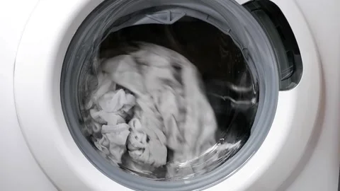 Washing clothes in a washing machine. Stock Footage 166316872
