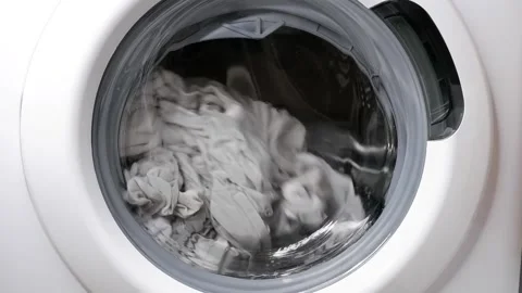 Washing clothes in a washing machine. Stock Footage 166456996