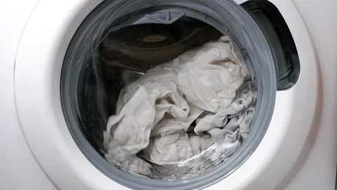 Washing clothes in a washing machine. Stock Footage 166569390