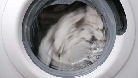 Washing clothes in a washing machine. Stock Footage 169470639