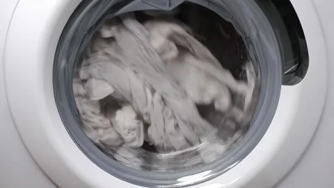 Washing clothes in a washing machine. Slow motion. Stock Footage 167366147