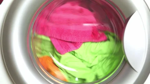 Washing colored laundry in the washing machine Stock Footage 232033112