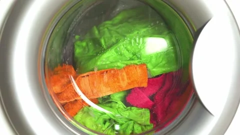 Washing colored laundry in the washing machine Video stock 234662753