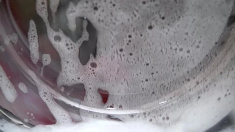 Washing colored laundry in the washing machine Video stock 255924289