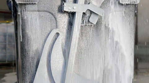 Washing the container. The garbage can is treated with a special foam Stock Footage 194449101