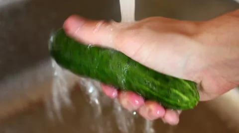 Washing cucumber. Stock Footage 55712209