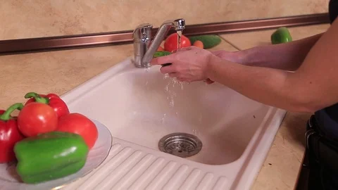 Washing cucumber tomato Stock Footage 100986592