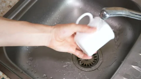Washing cup in the sink. Stock Footage 122376102