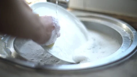 Washing Up Dinner Items in the Kitchen Sink for Clean Video stock 128172095