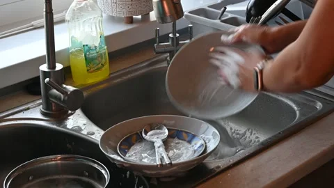 Washing the dishes in the kitchen Stock Footage 247834391