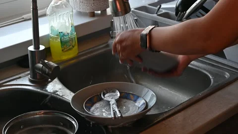 Washing the dishes in the kitchen Stock Footage 247834399