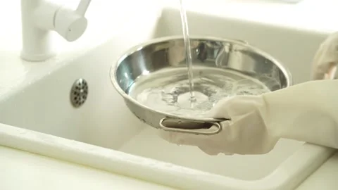 Washing Dishes in Kitchen Sink Close Up Stock Footage 335797574