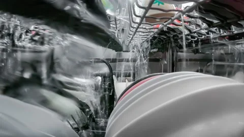 Washing dishes process inside the dishwasher Stock Footage 168905833