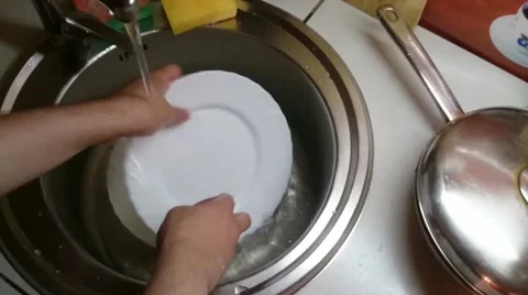 Washing dishes in the sink Stock Footage 64514980