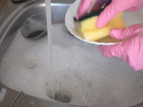 Washing dishes in the sink Stock Footage 80813048