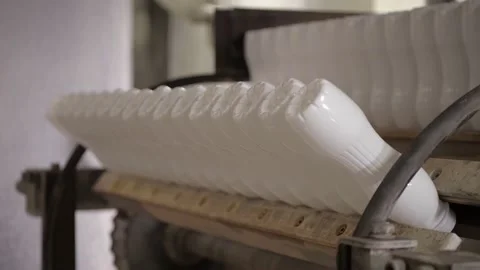 Washing an empty container before pouring yogurt into it Stock Footage 170668181
