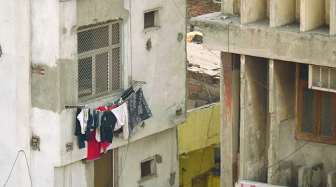 Washing flaps and swings while drying in the wind, hung out of a high rise Vídeos de archivo 51520540