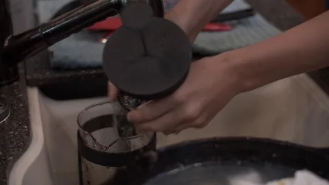 Washing French Press and Dishes in 5th Wheel RV Stock Footage
