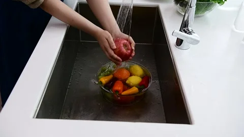 Washing Fresh Fruit in Kitchen Sink Close Up Stock Footage 335798313