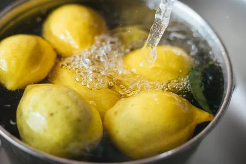 Washing fresh lemons Stock Photos