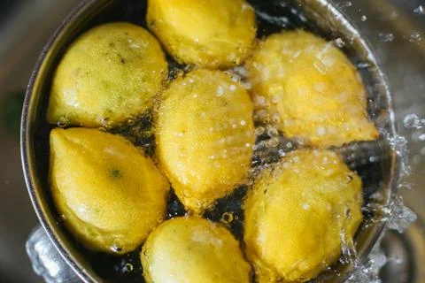 Washing fresh lemons Stock Photos