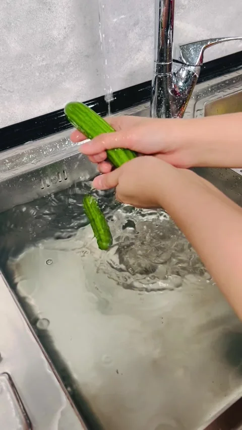 Washing Fresh Organic Cucumbers in Kitchen Sink - 9:16 Vertical Stock Video Stock Footage 338157846
