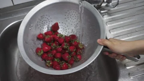 Washing fresh raw strawberries Stock Footage 132523616