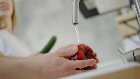 Washing fruit apple for breakfast. Close up. Stock-Footage 106836502