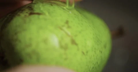 Washing fruit thoroughly, close-up, 4K Stock Footage 255964237