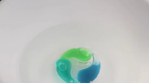 Washing gel capsule pod with laundry detergent to throw into the water. Stock Footage 263135904