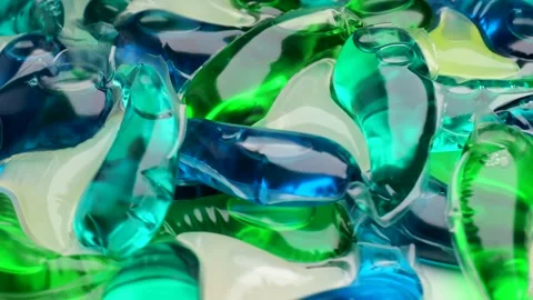 Washing gel capsule pod with laundry detergent, rotation in circle Stock Footage 263135987