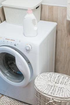 Washing gel liquid laundry detergent and fabric softener on washing machine Stock Photos