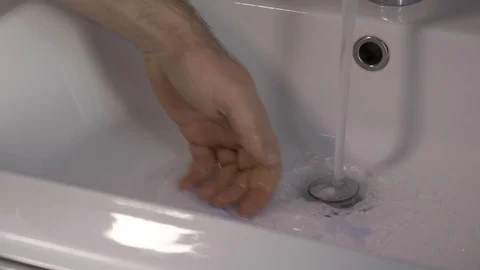 Washing an hand of a man Stock Footage 124635407