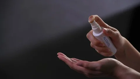 Washing hand by using alcohol spray . Stock Footage 126355218