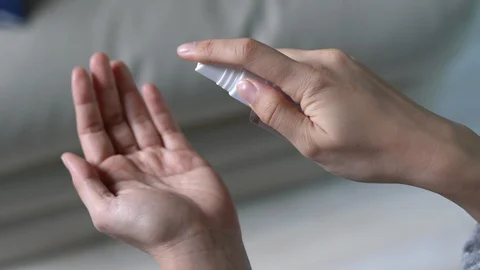 Washing hand by using alcohol spray to prevent coronavirus Stock Footage 128222558