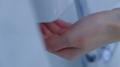 Washing hands with an automatic alcohol sanitizer dispenser Stock Footage 137311820