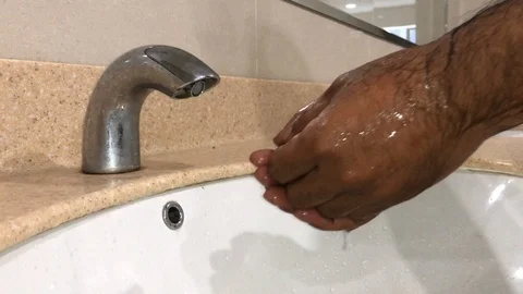 Washing hands with automatic sensor water tap. Energy saving concept. Stock Footage 105049228