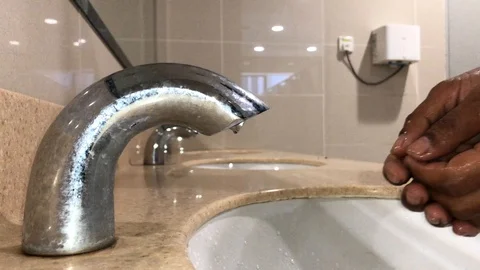 Washing hands with automatic sensor water tap. Energy saving concept Stock Footage 105049231