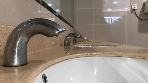 Washing hands with automatic sensor water tap. Energy saving concept Stock Footage 105049236