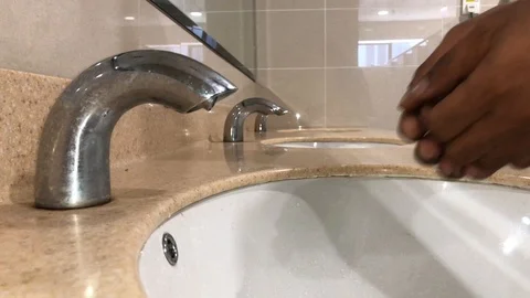 Washing hands with automatic sensor water tap. Energy saving concept. Stock Footage 105049237