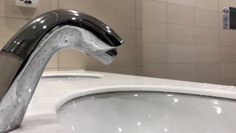 Washing hands with automatic sensor water tap. Energy saving concept. Stock Footage 105049318